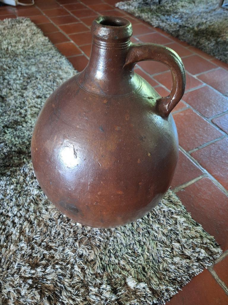 Grote bruine stenen pot, Ophalen