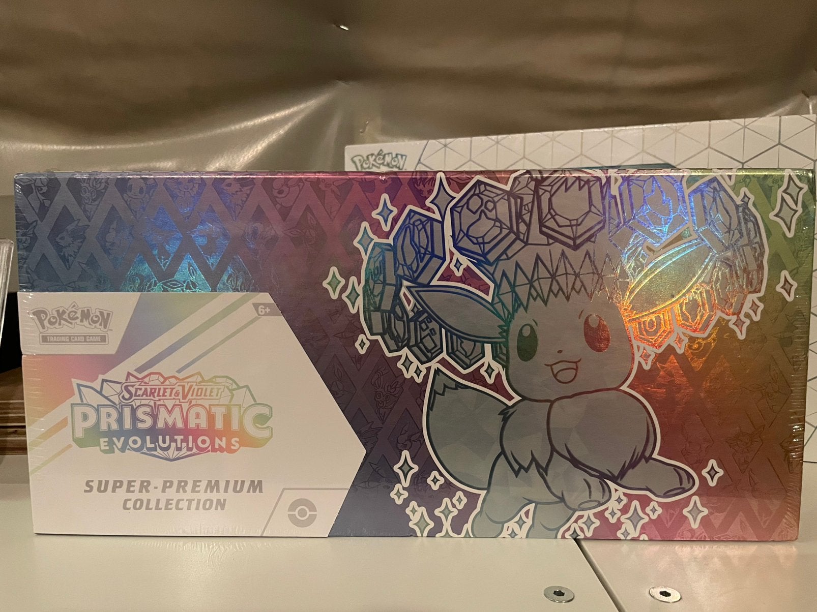 Prismatic Evolutions Super Premium Collection, Ophalen of Verzenden, Nieuw, Booster