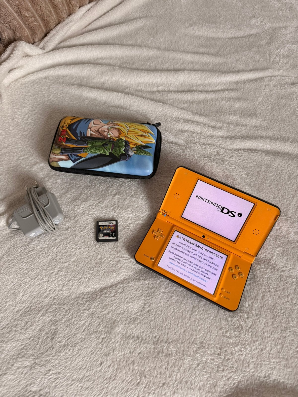 Nintendo DSi XL orange + Pokémon Perle + pochette Dragon, Ophalen of Verzenden, Zo goed als nieuw