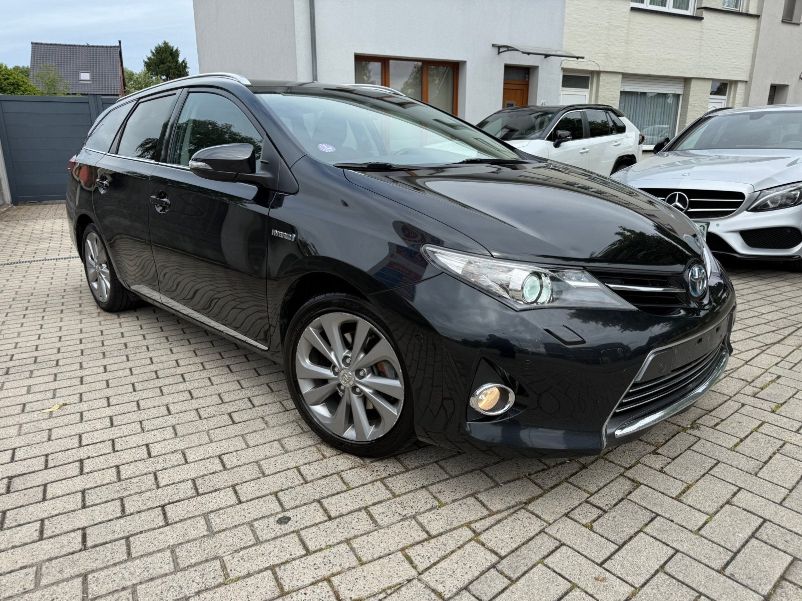 Toyota Auris 1.8 HYBRIDE voll voll. JBL, Zwart, 4 cilinders, Leder en Stof, Zwart
