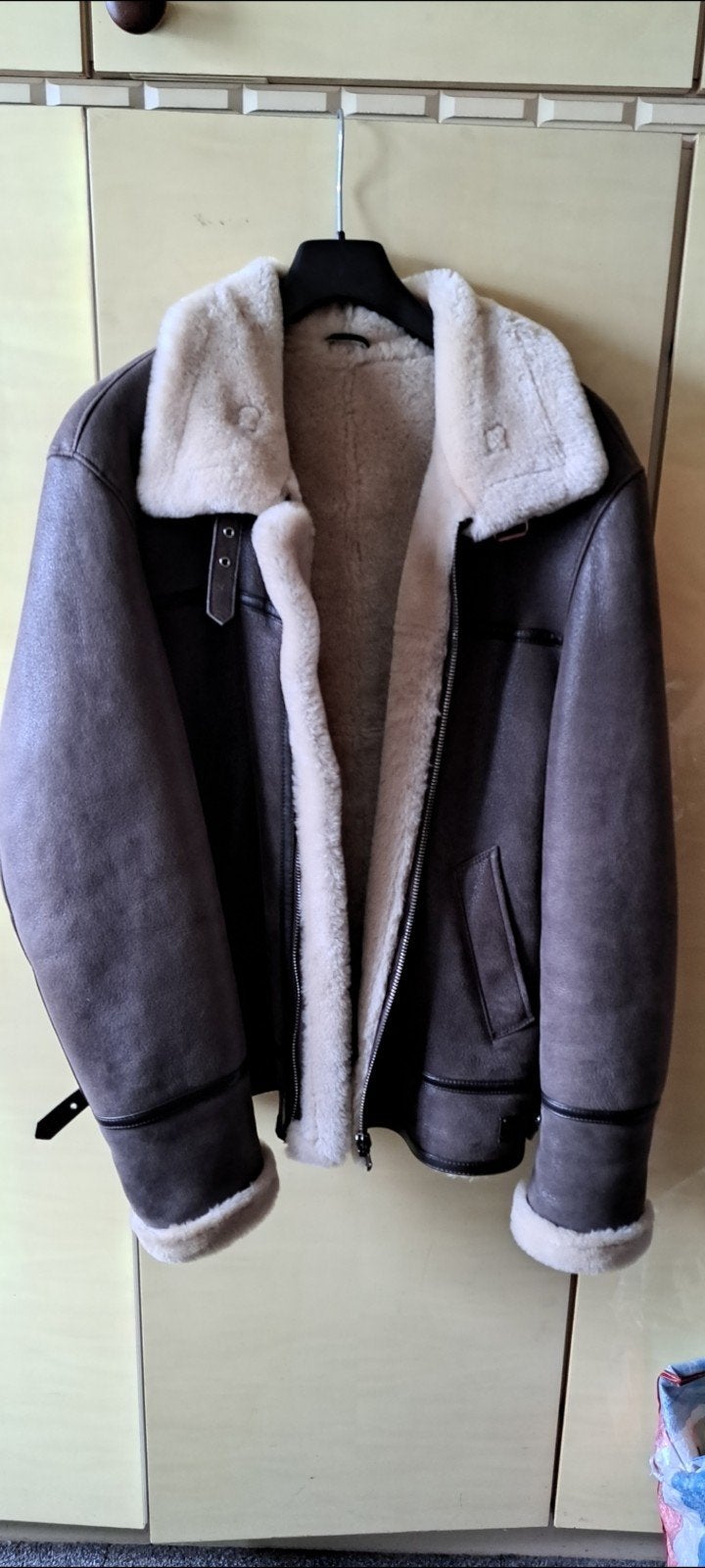 blouson style aviateur mouton retourné, Enlèvement