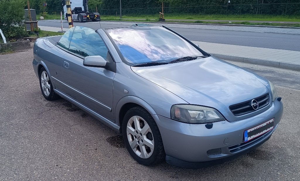 Opel Astra BERTONE G 1.8 16V 125pk - meeneemprijs €999, Auto's, Voorwielaandrijving, 4 zetels, Zwart, Cabriolet