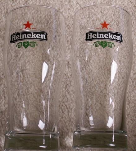 2 Heineken bierglazen met achterzijde wit logo spiegelbeeld, Ophalen of Verzenden, Nieuw, Heineken