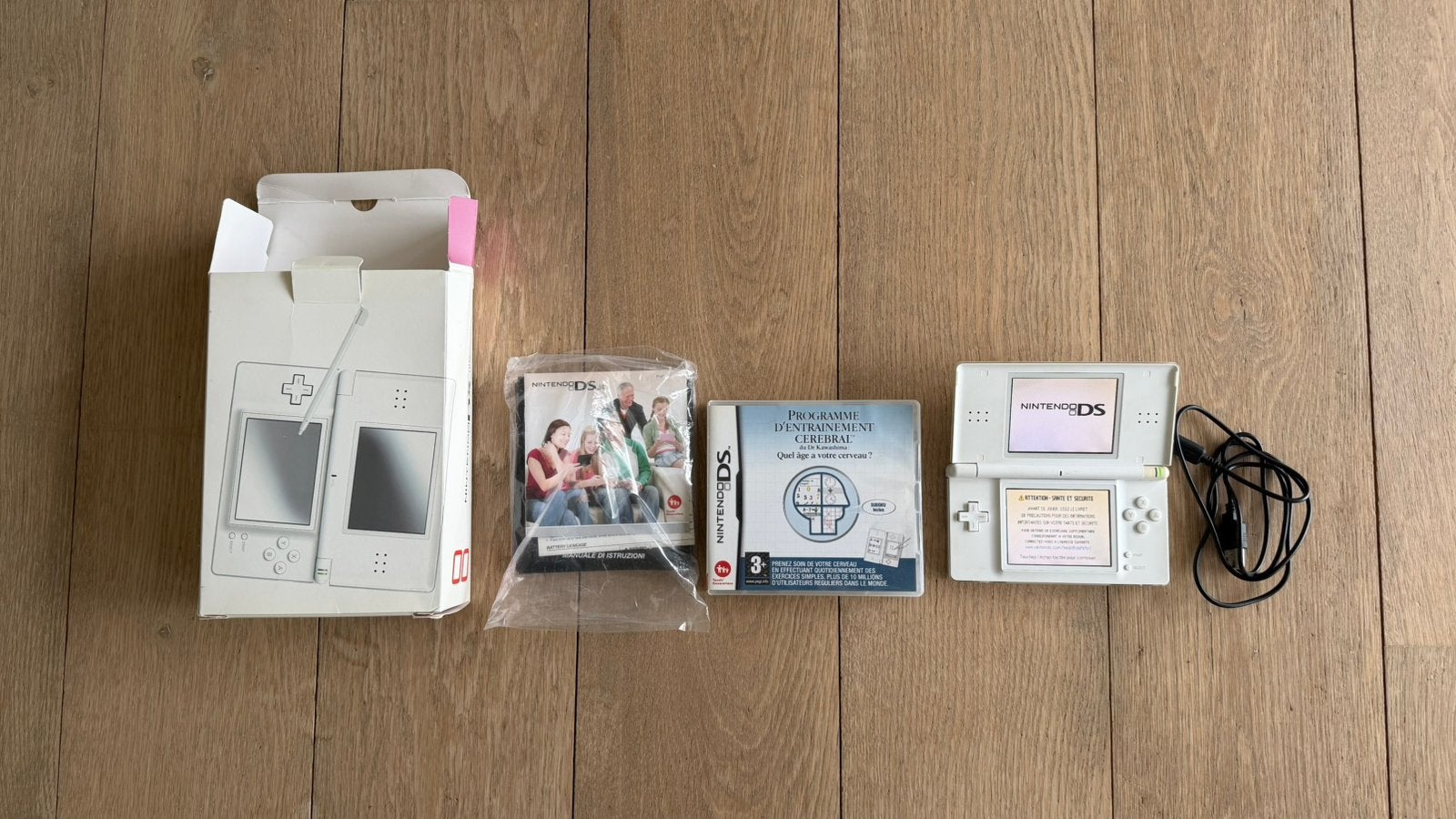 Nintendo DS Lite blanche + boîte + jeu + stylet, Games en Spelcomputers, Met games, Gebruikt, Wit, Ophalen of Verzenden