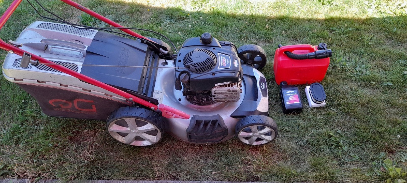 Grasmaaier/Grasmachine op benzine, Ophalen
