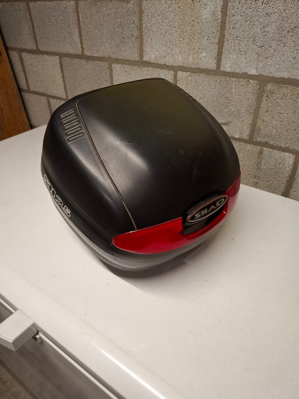 Kofferbak scooter, Ophalen
