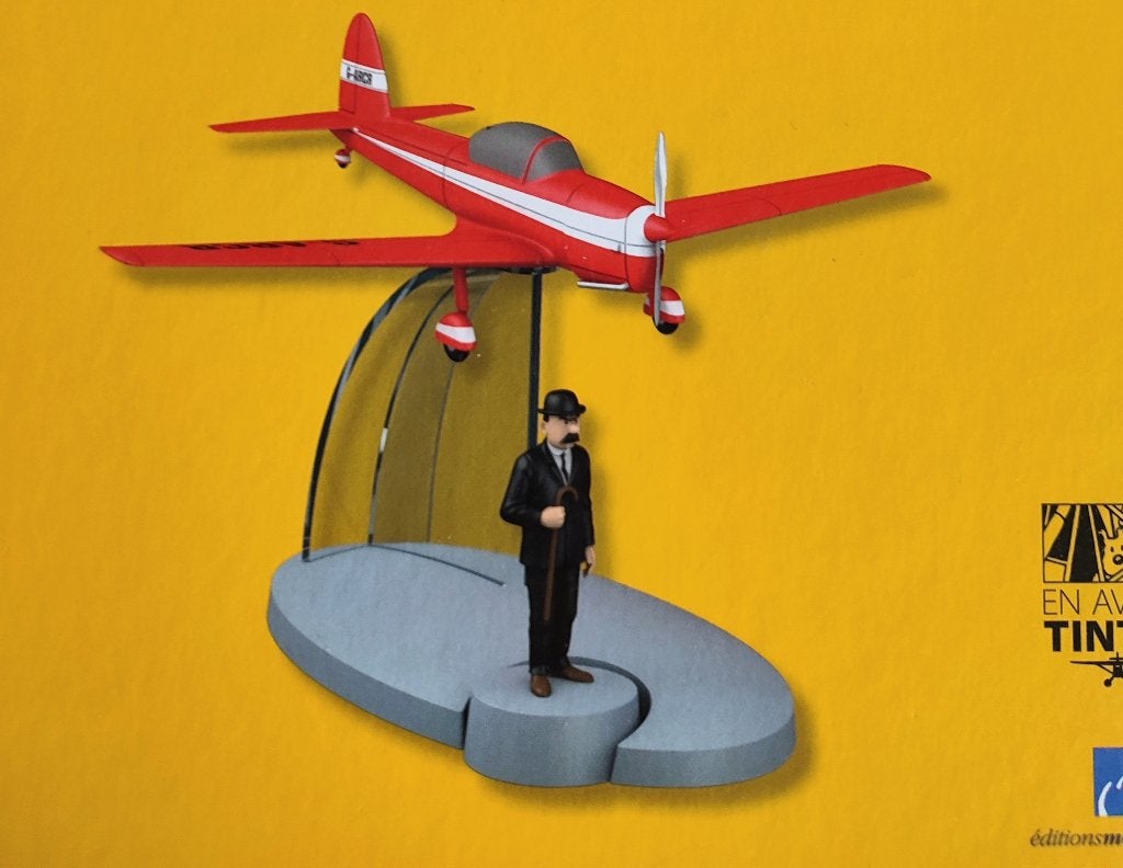 Tintin en avion n° 8. Avion, support, figurine, livret, Enlèvement ou Envoi, Tintin, Neuf, Statue ou Figurine