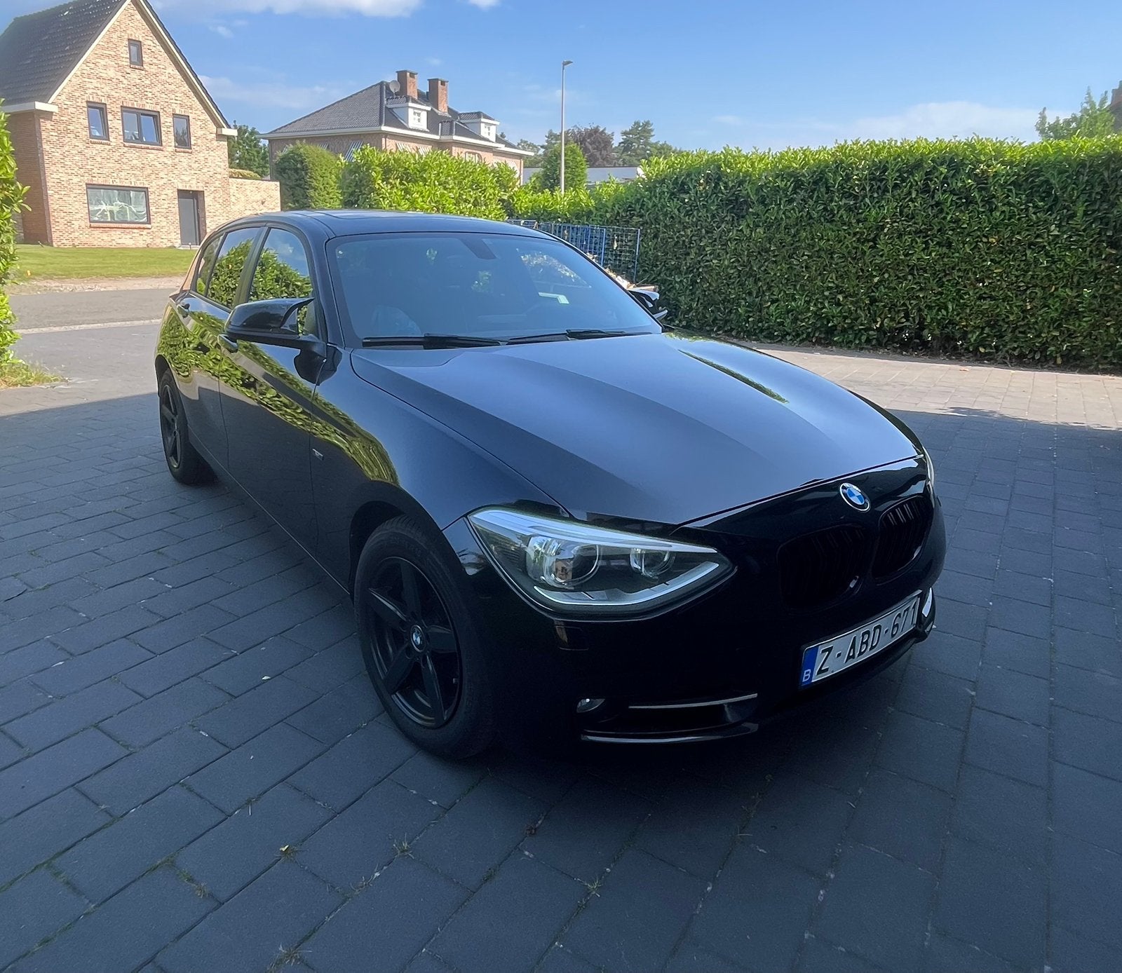 BMW 1 reeks 116i (F20) 100 kw benzine GARANTIE, Auto's, BMW, 100 kW, Euro 5, Zwart, 4 cilinders