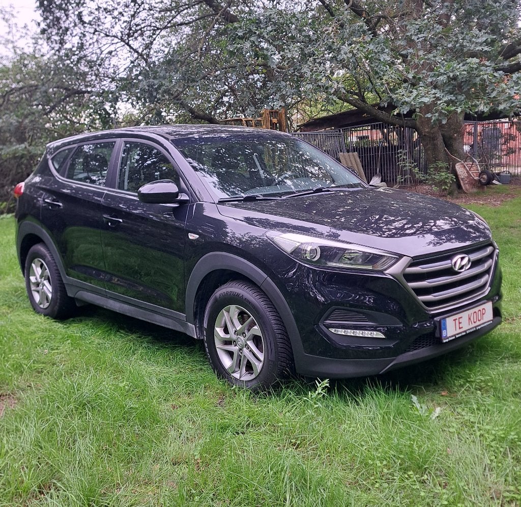 Hyundai Tucson: 59.000km + airco +garantie + groot nazicht!, Voorwielaandrijving, Stof, 4 cilinders, Zwart
