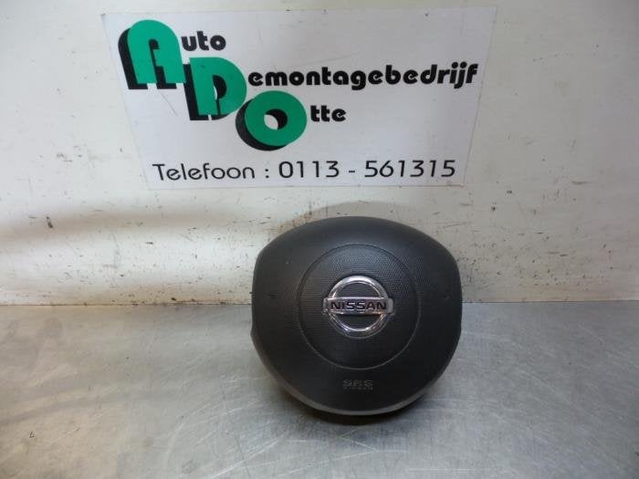 Airbag gauche (volant) d'un Nissan Micra (Micra 03-), -, 3 mois de garantie, Utilisé, -