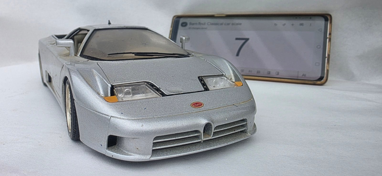 N 7 — Bugatti EB110 (1991) — Bburago — 1:18, Hobby & Loisirs créatifs, Voitures miniatures | 1:18, Enlèvement ou Envoi, Utilisé