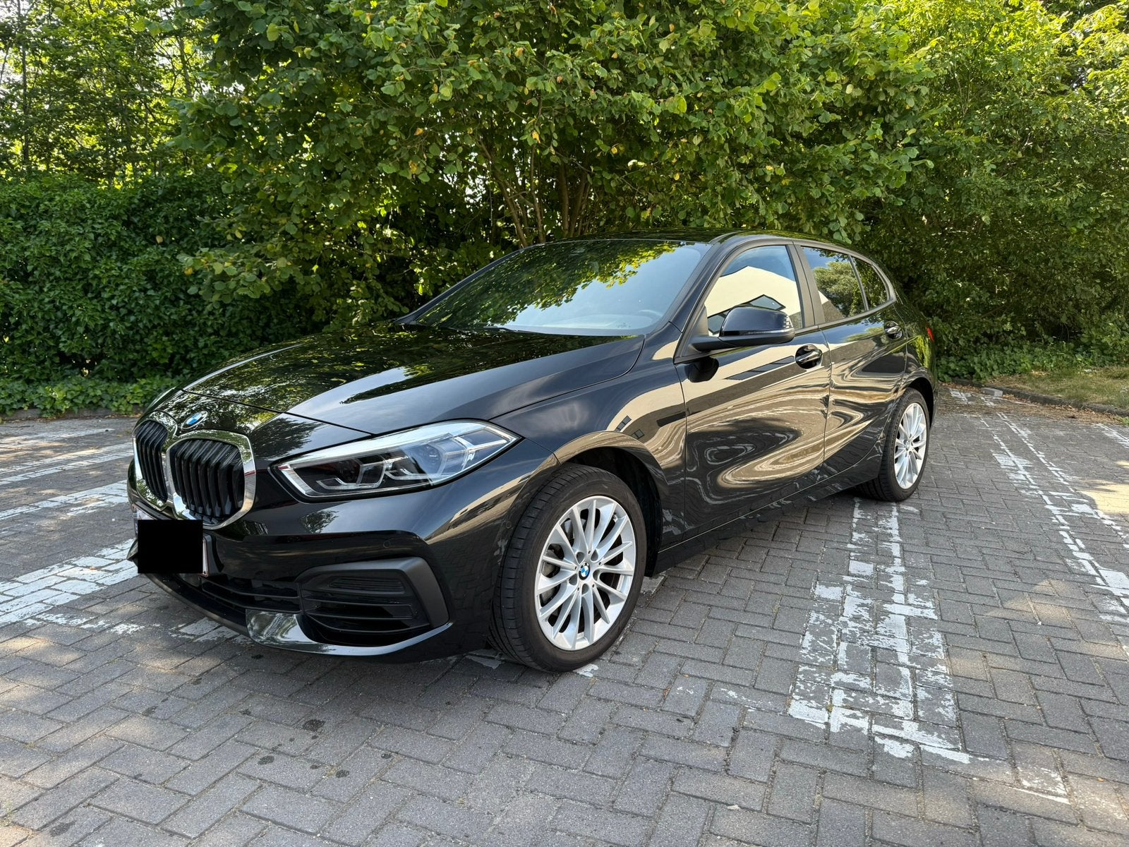 BMW 116i Automaat 2023 premium garantie tot 2028 !!, 1 Reeks, Leder en Stof, Zwart, Particulier