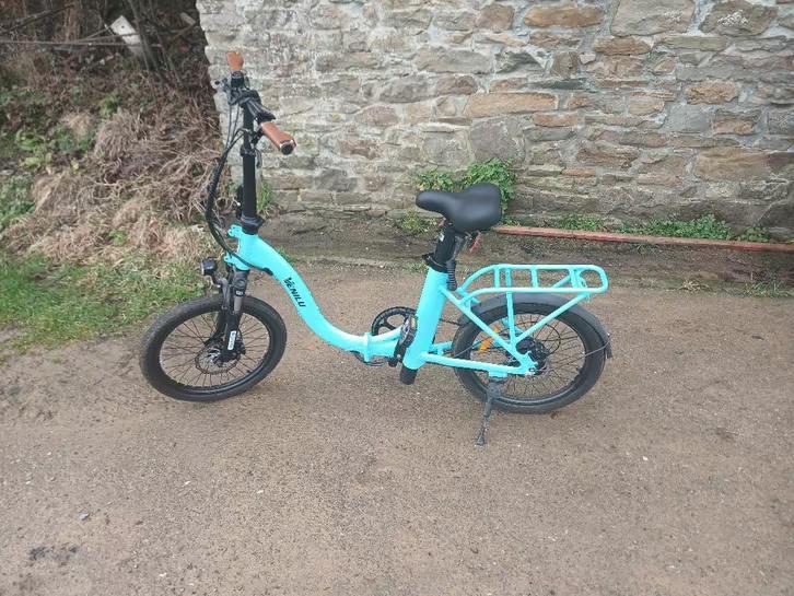 Vélo pliable éléctrique, Fietsen en Brommers, Elektrische fietsen, Ophalen, Zo goed als nieuw, 30 tot 50 km per accu, Vanmoof