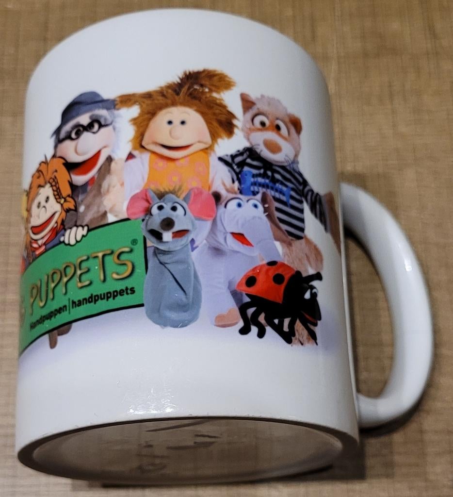 Living Puppets: mooie drinktas, Ophalen of Verzenden, Zo goed als nieuw, Porselein, Kop(pen) en/of Schotel(s)