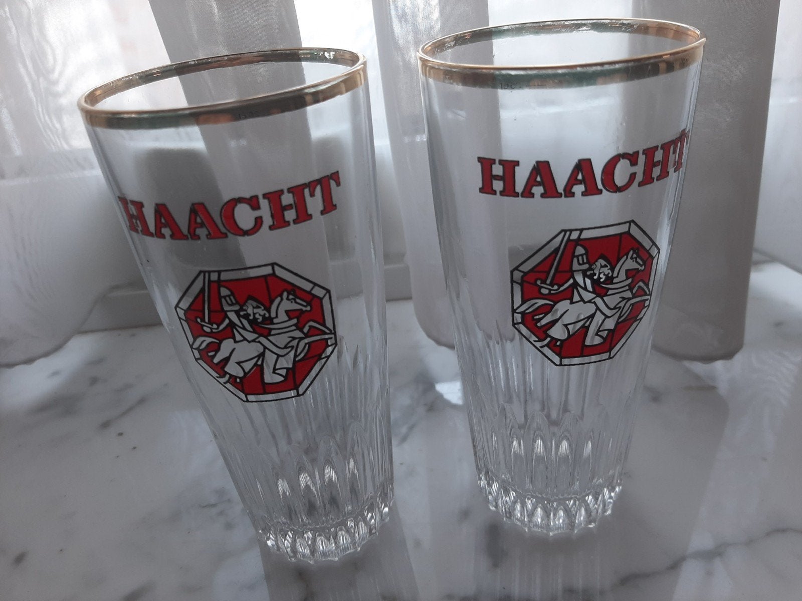 2 vintage Haacht bierglazen 25 cl – oud logo – gouden rand, Ophalen of Verzenden