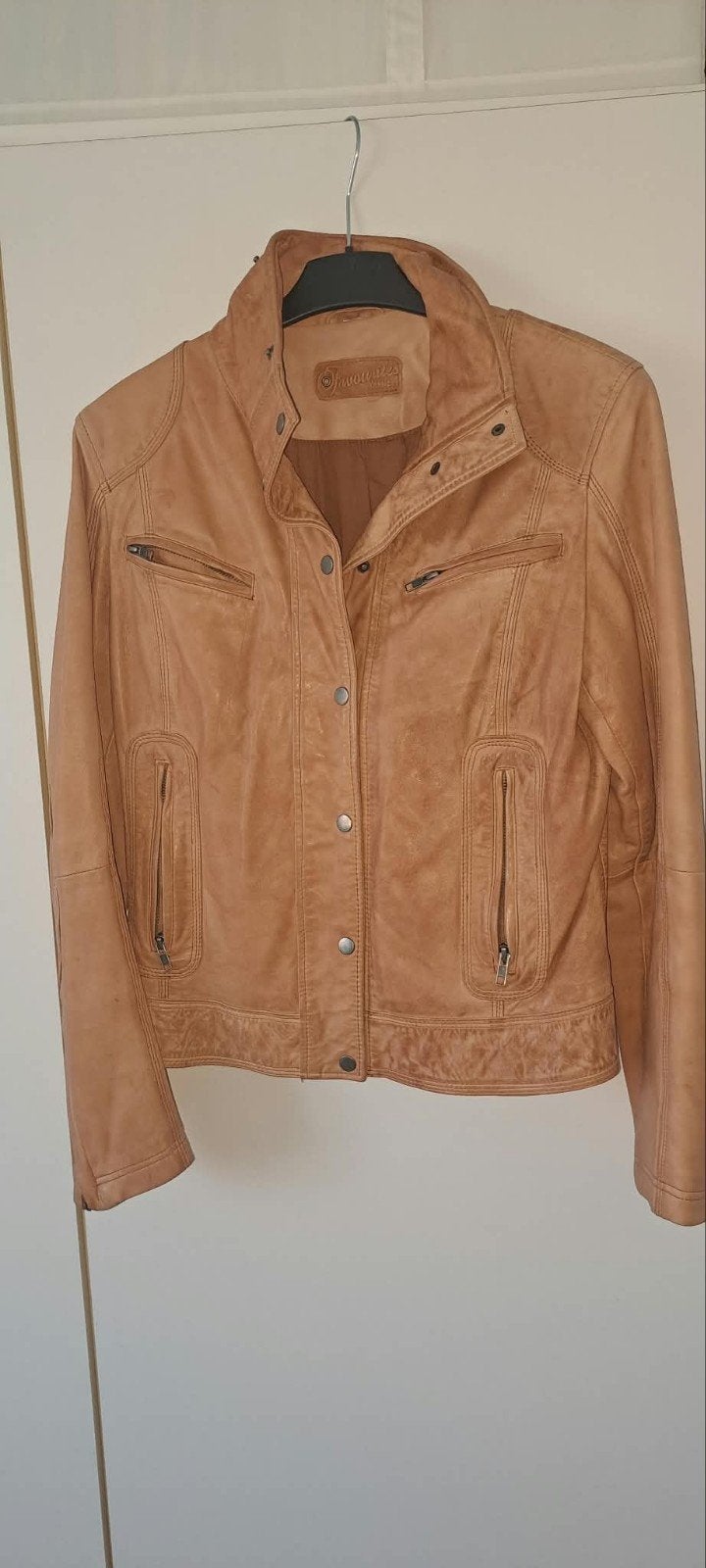 jas van koeienhuid, Ophalen, Beige