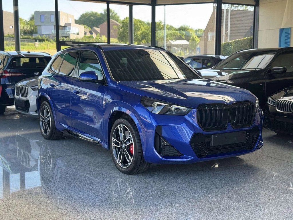 BMW X1 xDrive25e M Sport Pro / PANO / TRKHK / BLIND / MEM, 245 pk, Gebruikt, Zwart, Blauw