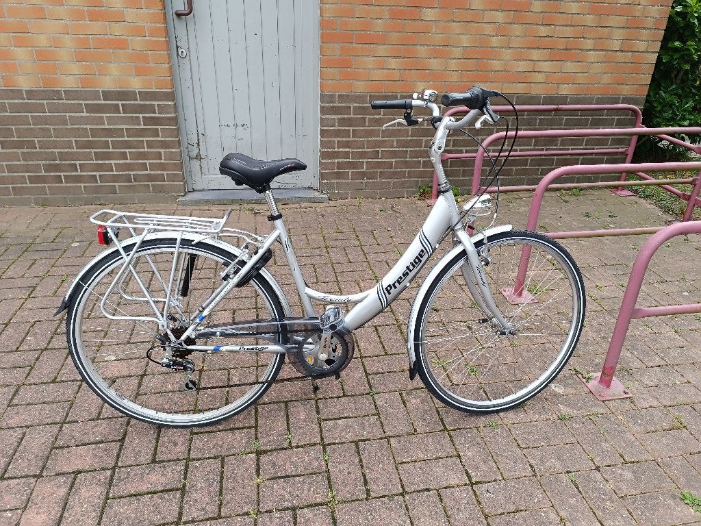 Fiets " Prestige " zilverkleurig, Fietsen en Brommers, Fietsen | Cruisers en Lowriders, Ophalen, Velgrem, Overige typen, Aluminium