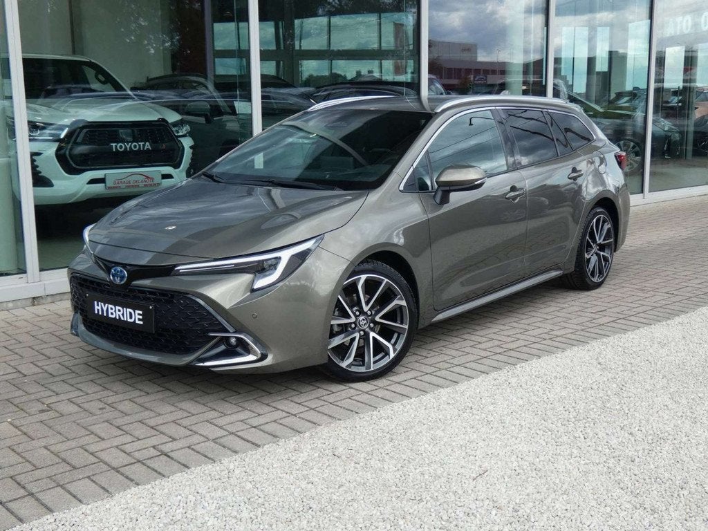 Toyota Corolla 1.8 Hybrid Premium 140pk +Trekhaak +Head-up d, Auto's, Gebruikt, Zwart, Bruin, Corolla