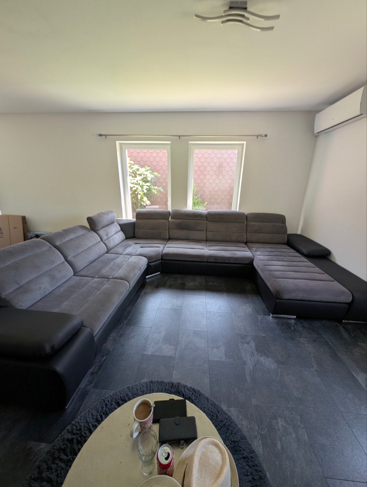 Divan en U gris anthracite et simili cuir noir, Enlèvement