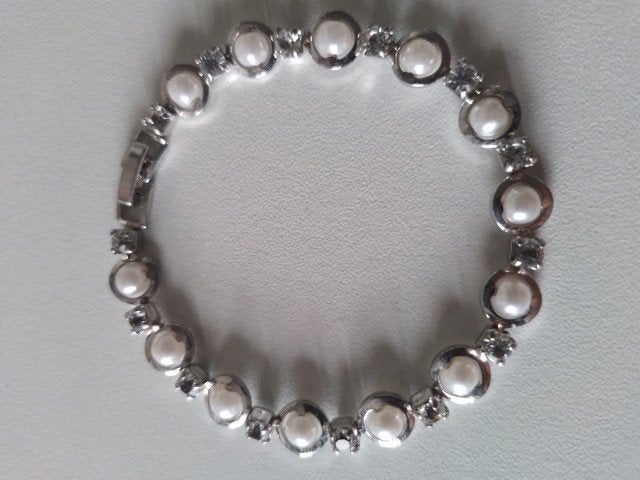 Armbandje, Ophalen of Verzenden, Zo goed als nieuw, Overige materialen, Met bedels of kralen