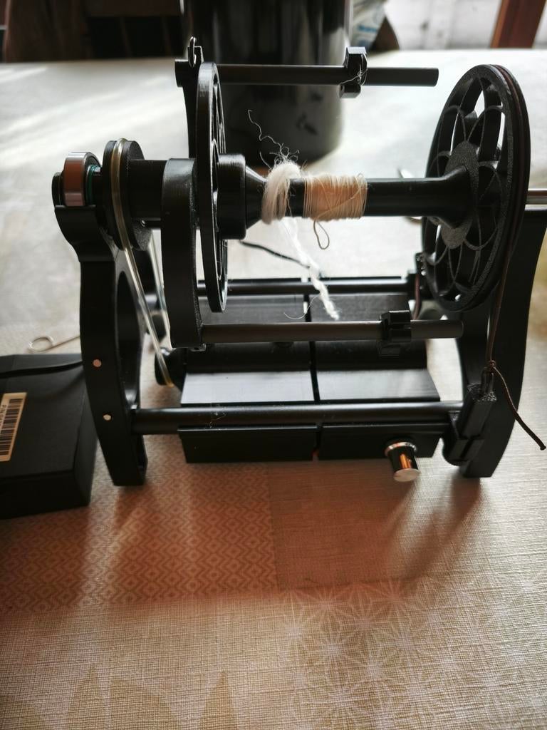 Elektrische spinnewiel, Ophalen