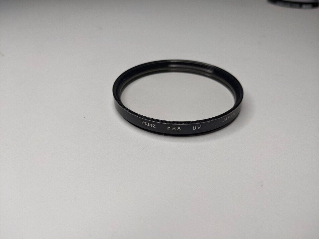 Filtre UV 58 mm, TV, Hi-fi & Vidéo, Photo | Filtres, Autres marques, Enlèvement ou Envoi, Étui de rangement inclus, 50 à 60 mm