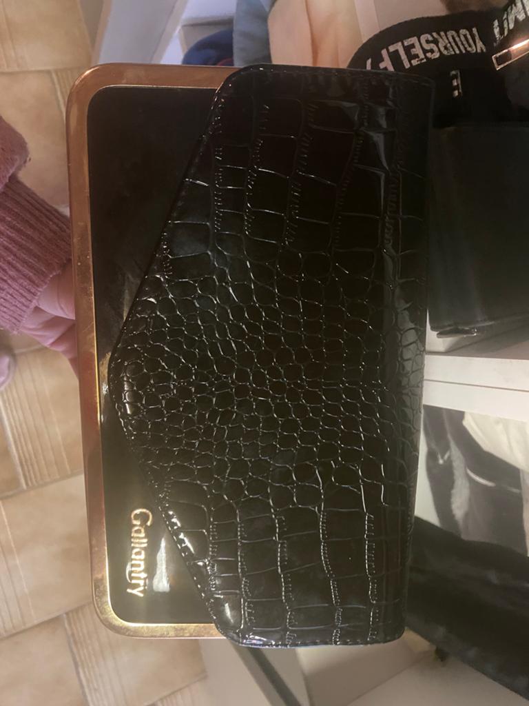 Zwarte clutch, Ophalen, Zo goed als nieuw