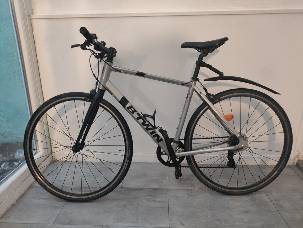 Herenfiets B-TWIN TRIBAN 100 maat M, Ophalen