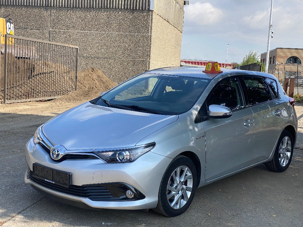 Toyota Auris HEV 1.8i HSD Dynamic E-CVT, Auto's, Dealer onderhouden, Stof, 4 cilinders, Bedrijf