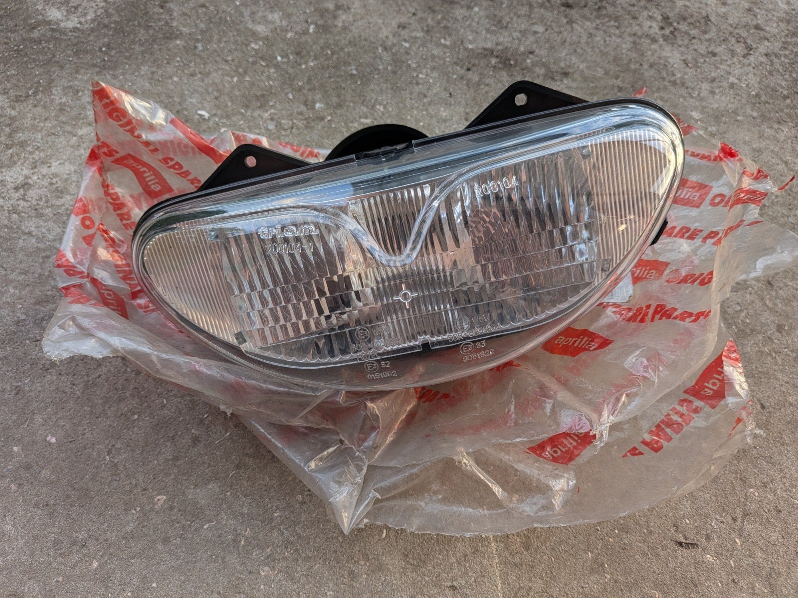 Nieuwe Aprilia RS50 koplamp., Motoren, Onderdelen | Overige, Ophalen