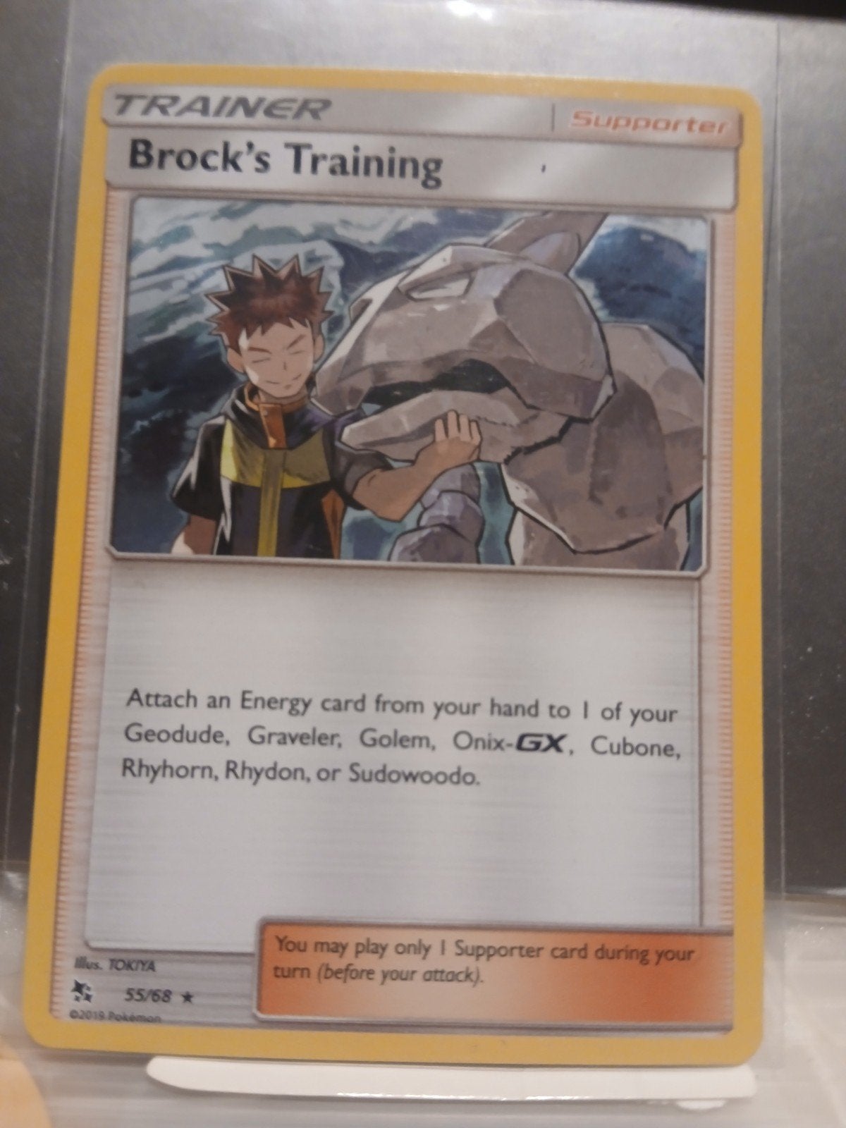 brock´s training holo 55 pokemon hidden fates, Enlèvement ou Envoi, Neuf, Cartes en vrac, Foil