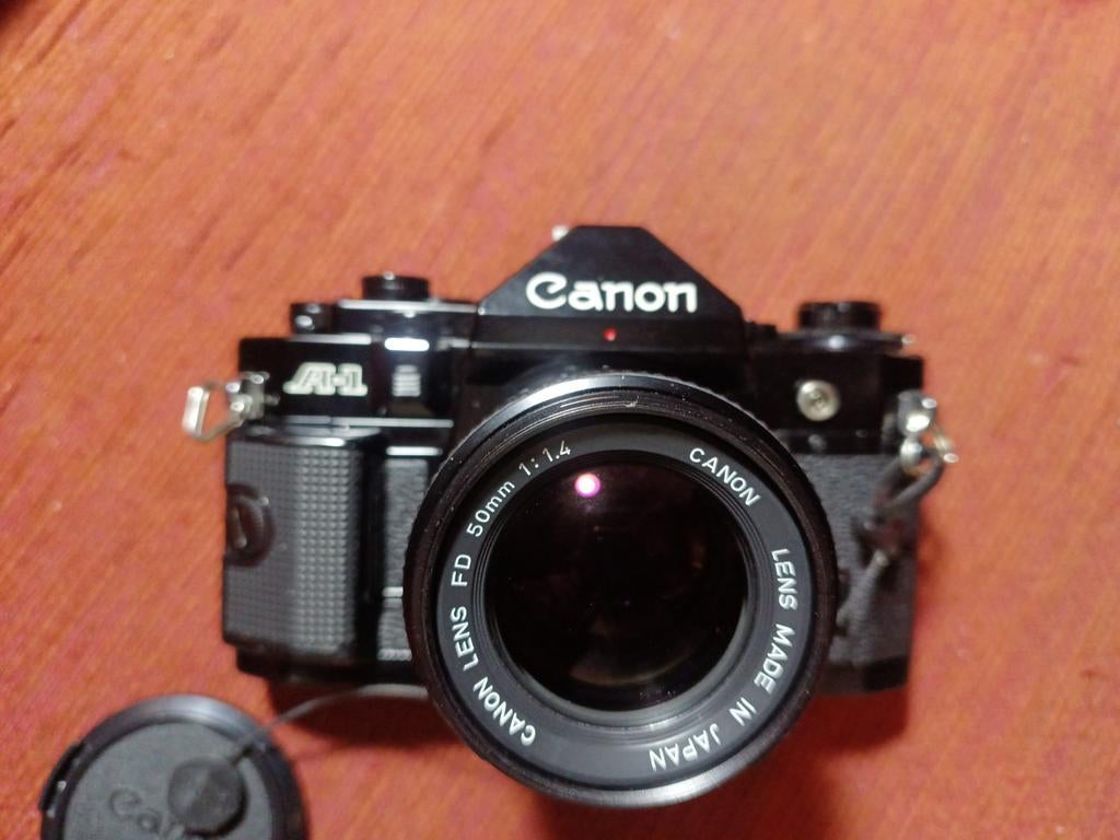 Canon A1+50mm1.4 filmcamera + accessoires., Canon