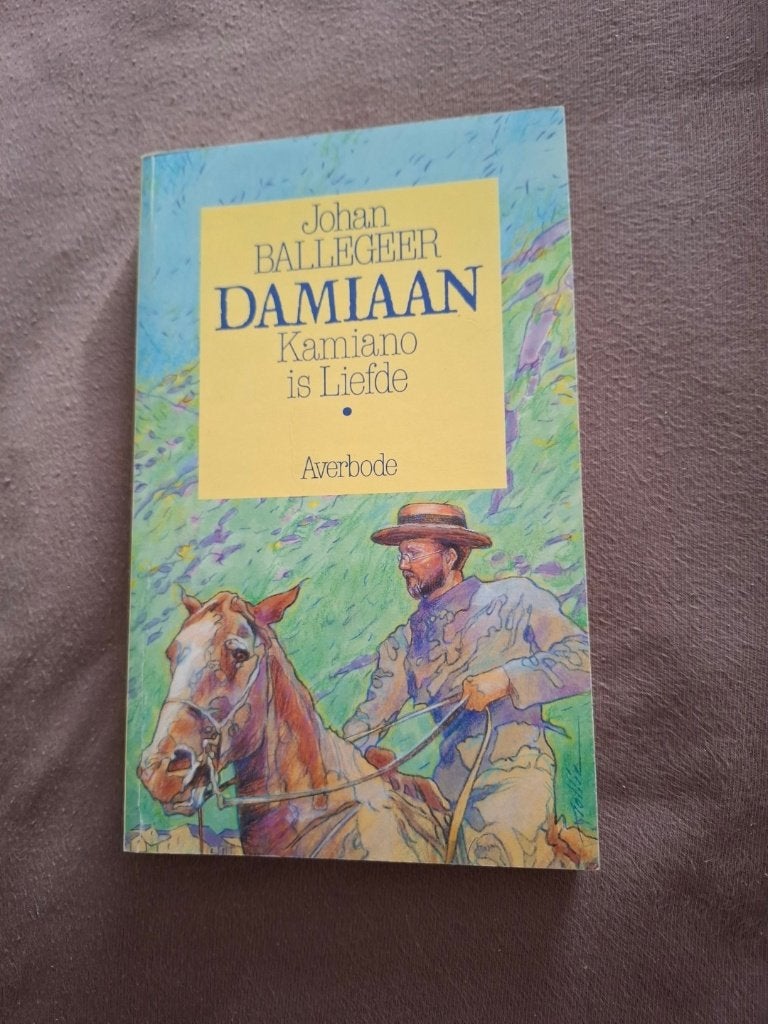 Boek Damiaan, Kamiano is Liefde, België, Ophalen of Verzenden, Zo goed als nieuw, Johan Ballegeer