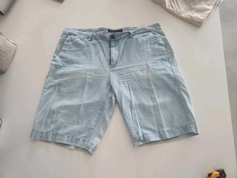 Trussardi chino lichtblauw, maat 52 (L), Maat 52/54 (L), Blauw, Ophalen of Verzenden, Gedragen