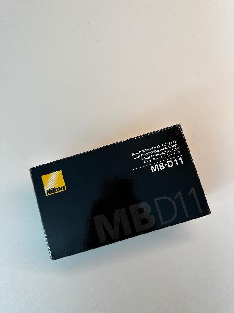 Nikon MB-D11, Audio, Tv en Foto, Fotocamera's Digitaal, Ophalen of Verzenden, Zo goed als nieuw, Compact, Nikon