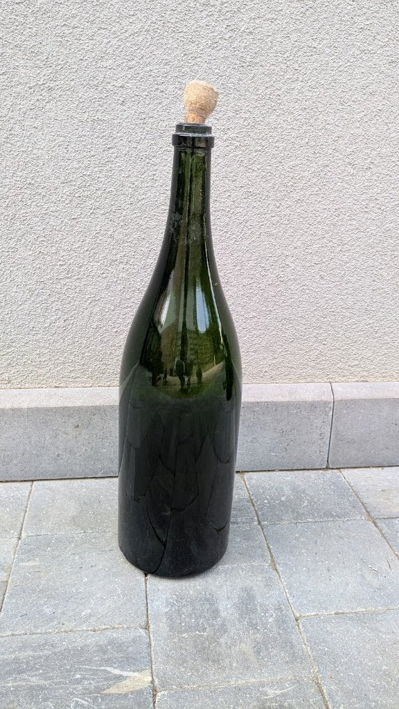 Grote groene fles met dop, Ophalen