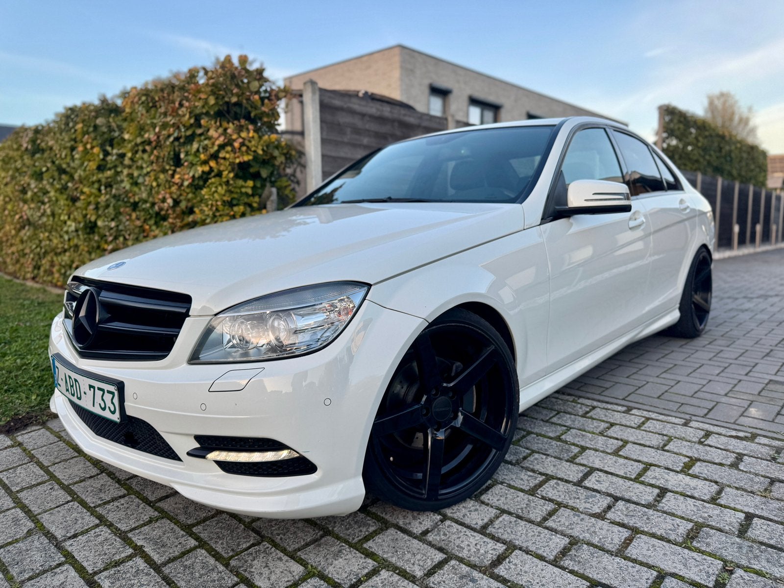MERCEDES BENZ C180 BENZINE AMG PACK | VOSSEN/NAVI | GARANTIE, Auto's, Dealer onderhouden, Achterwielaandrijving, Zwart, Leder en Stof