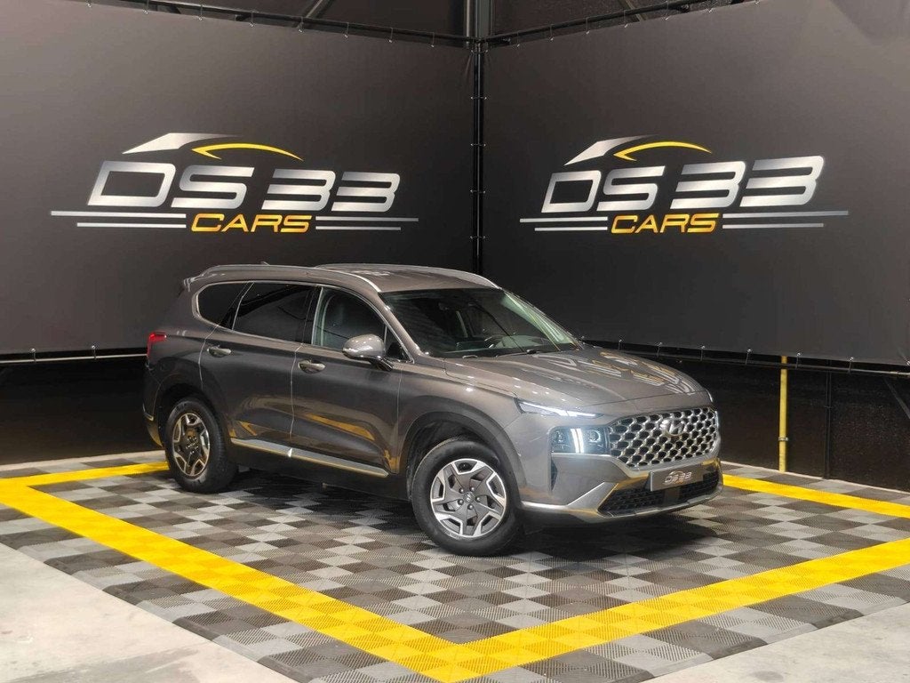 Hyundai Santa Fe 1.6 HEV T-GDi 180pk 7-zit/MemoryLeder/AdCru, Auto's, Hyundai, Santa Fe, Zwart, 4 cilinders, Sound system