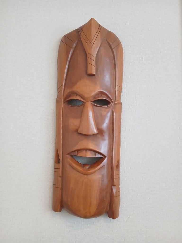 Masker in hout, Ophalen