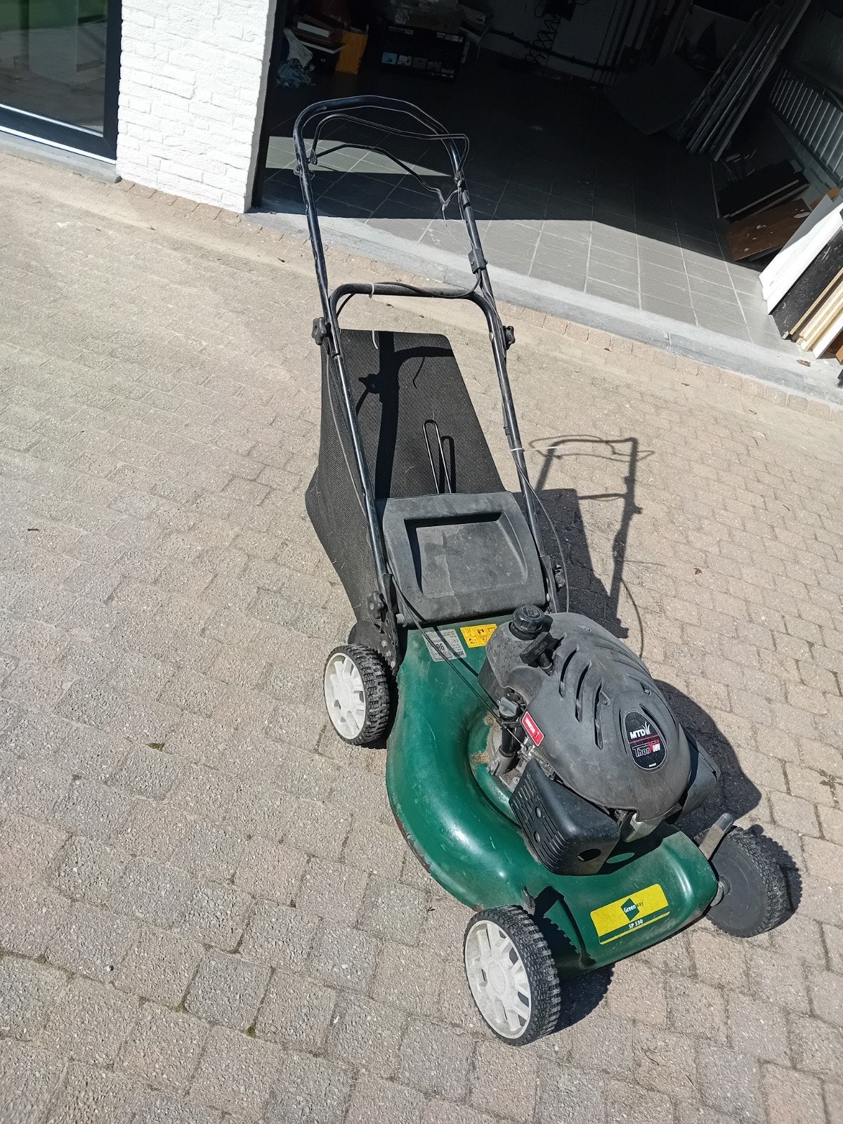 grasmaaier benzine, Ophalen