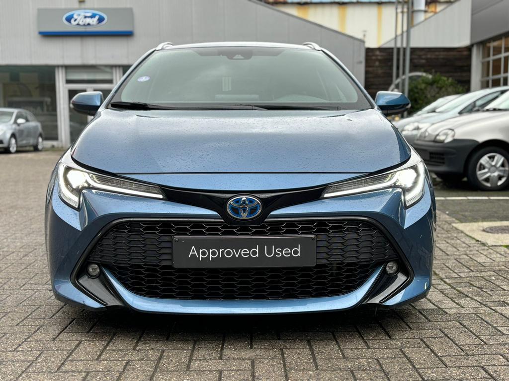 Toyota Corolla Touring Sport 1.8 VVT-I Hybride Style, Auto's, Stof, 4 cilinders, Blauw, Corolla