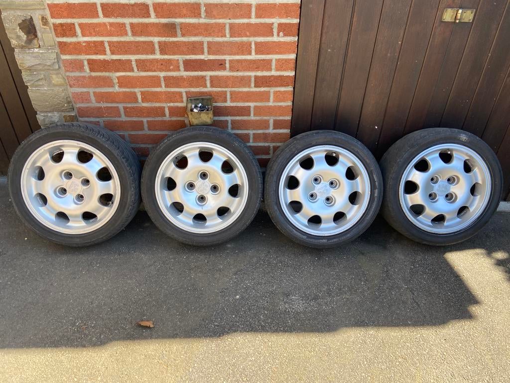 4 jantes en alliage + pneus + boulons pour Peugeot 205 GTI, Auto-onderdelen, Banden en Velgen, Ophalen, Band(en)