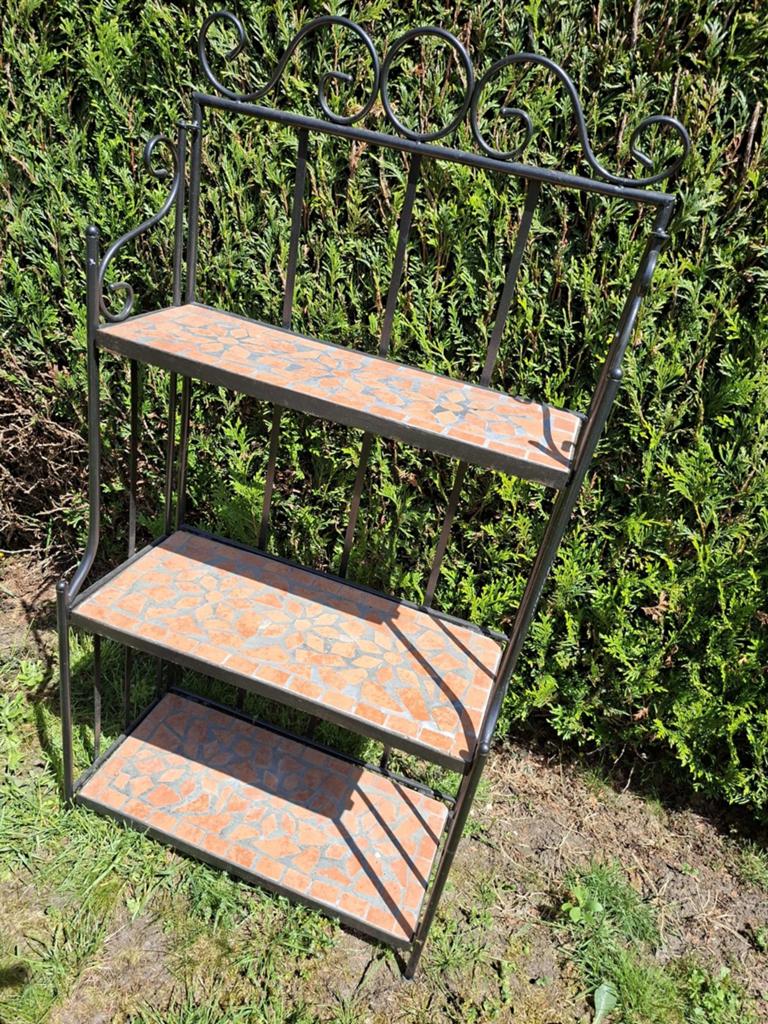 Gietijzeren bloemenrek, Ophalen