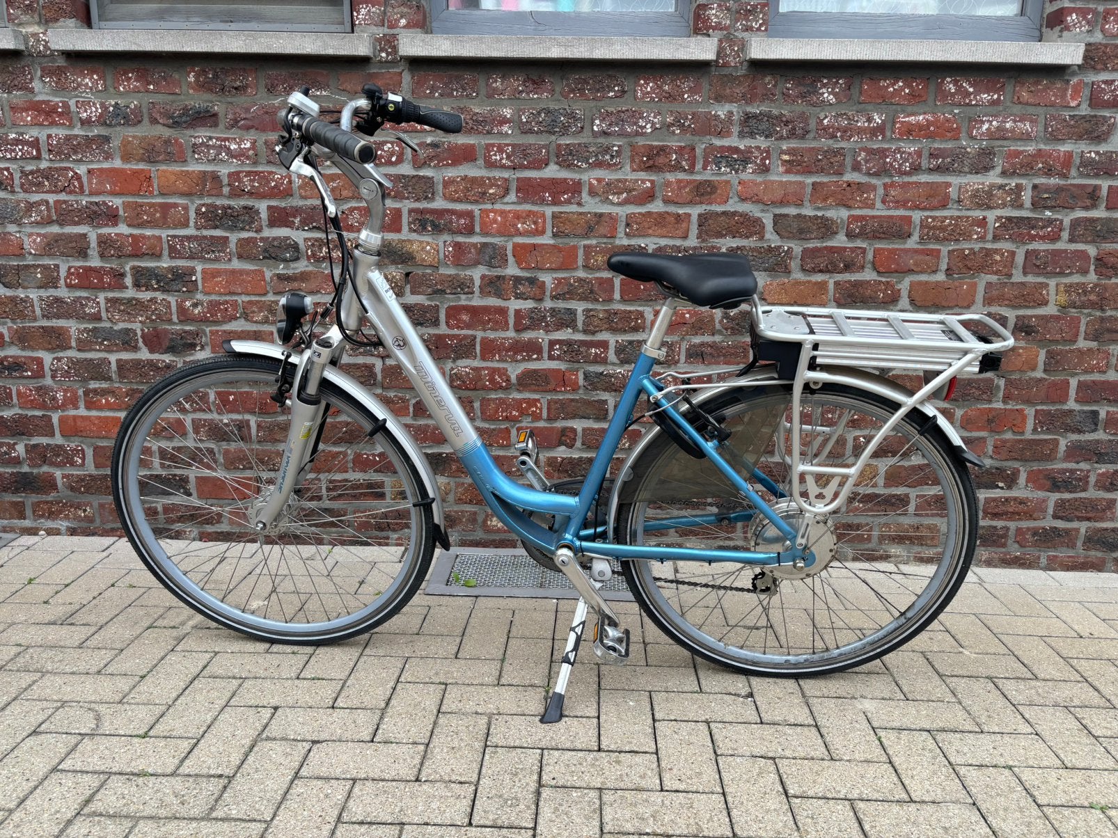 Elektrische damesfiets Minerva, Fietsen en Brommers, Ophalen, Gebruikt, Minder dan 30 km per accu, Overige merken