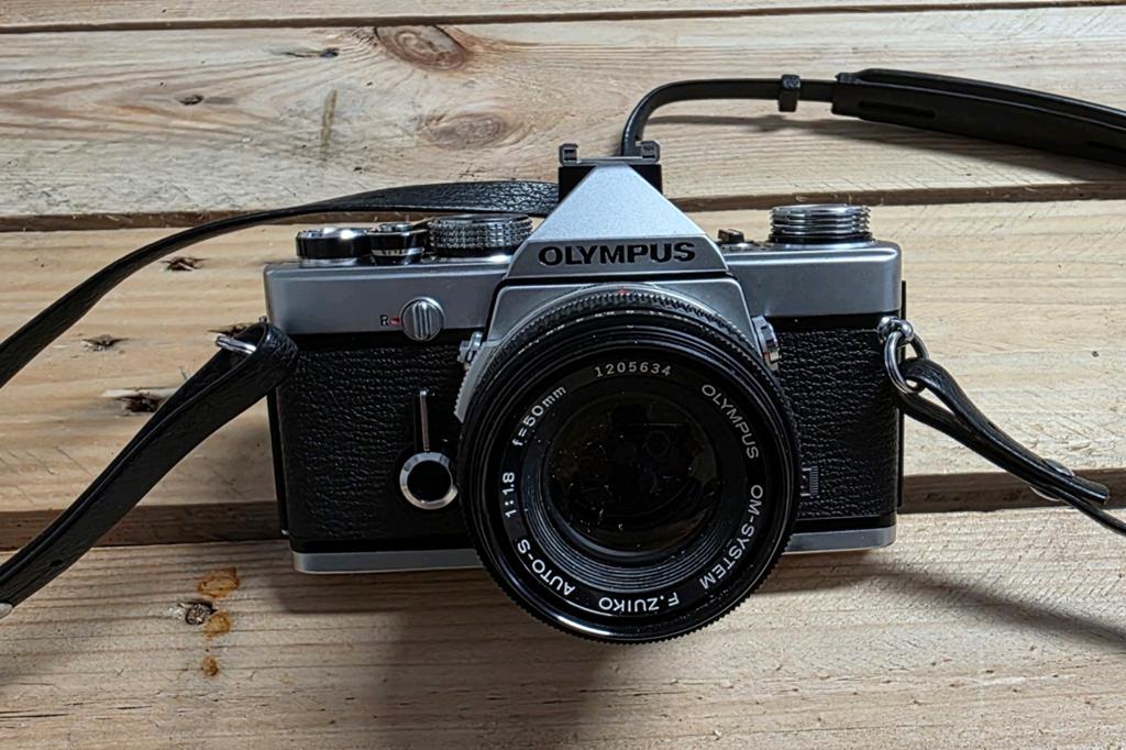 OLYMPUS OM-1, Ophalen, Olympus