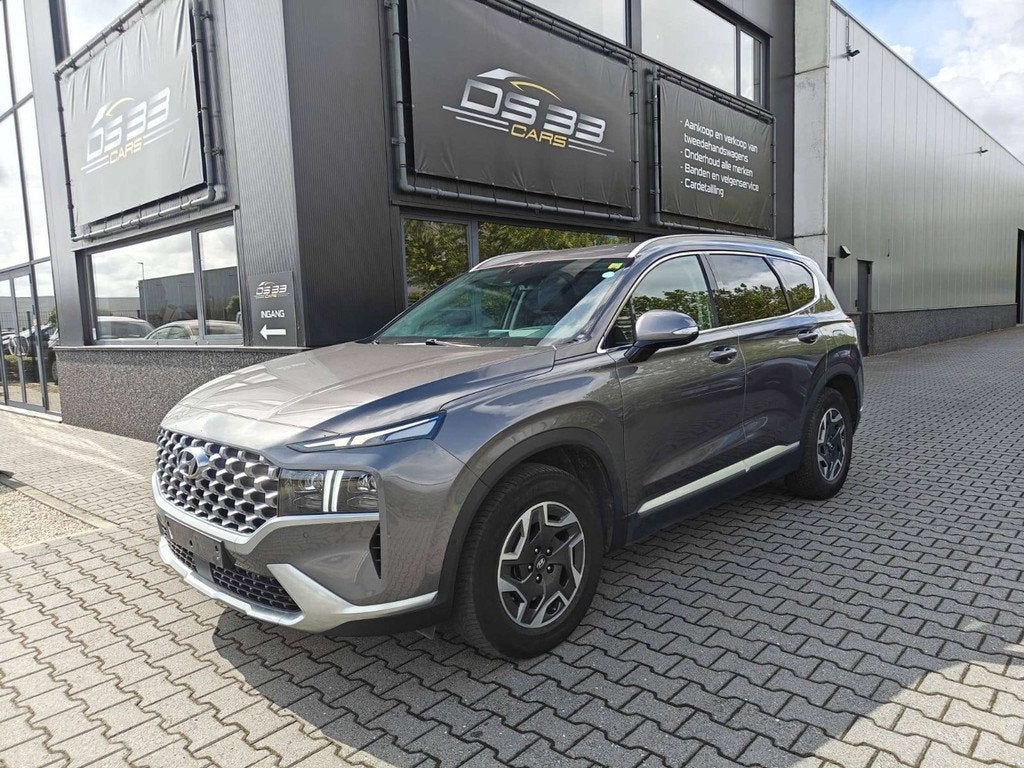 Hyundai Santa Fe 1.6 HEV T-GDi 180pk 7-zit/MemoryLeder/AdCru, Autos, Hyundai, Argent ou Gris, Entreprise, 7 places, 179 ch