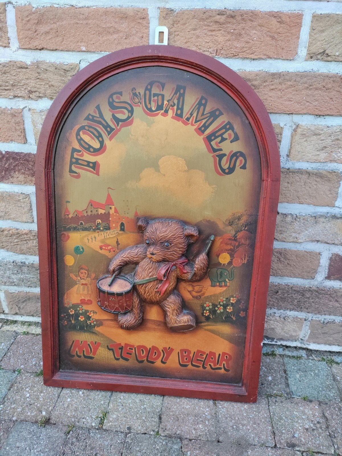 Houten bord met beer, Ophalen