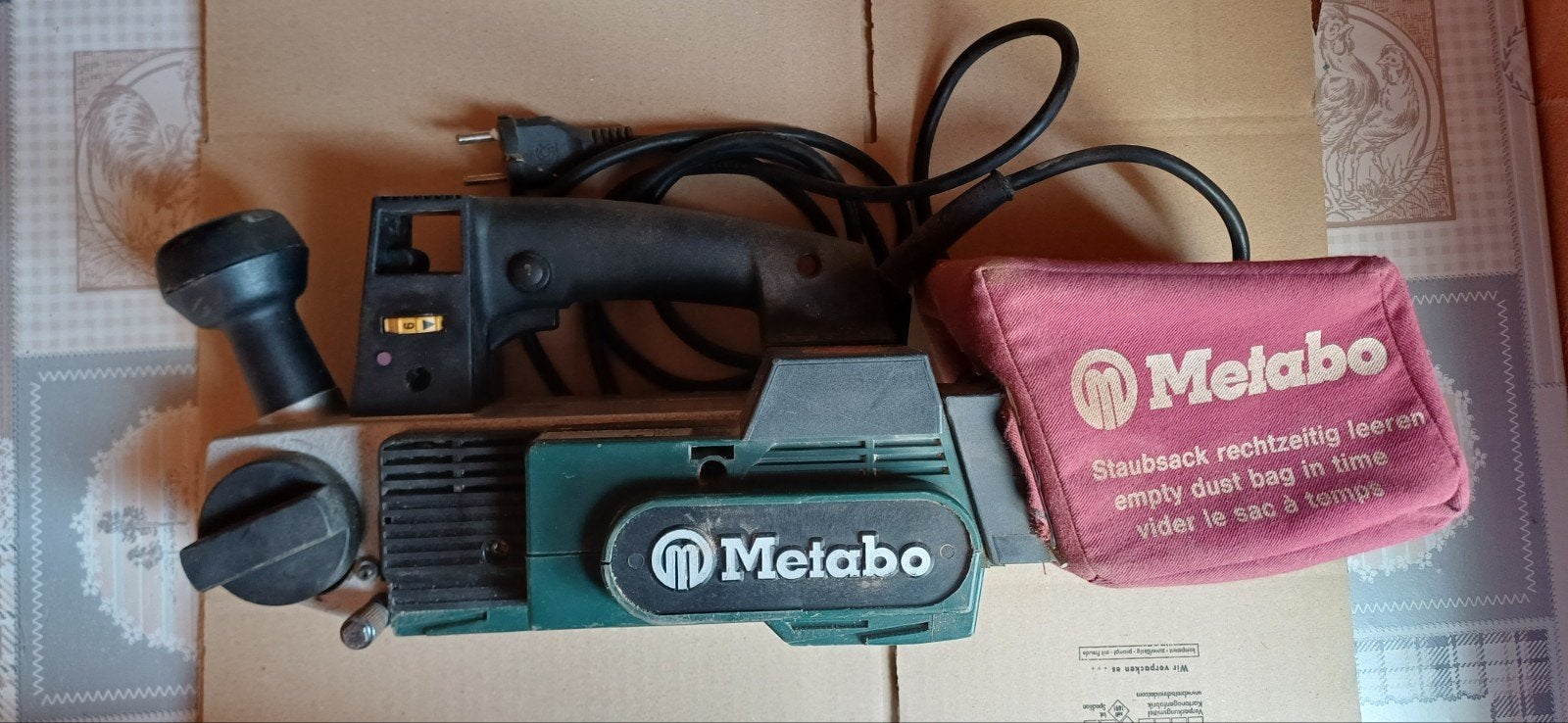 Ponceuse à bande Metabo, modèle Ba E 0876, Enlèvement
