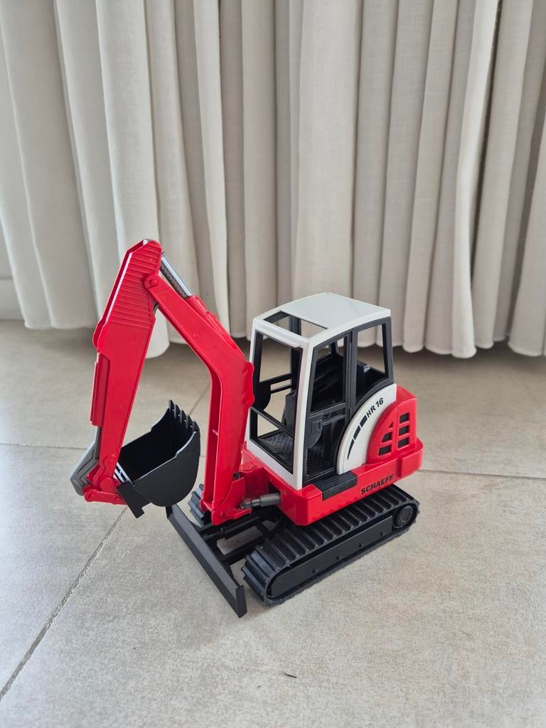 Schaeff grijper minigraafmachine, Ophalen